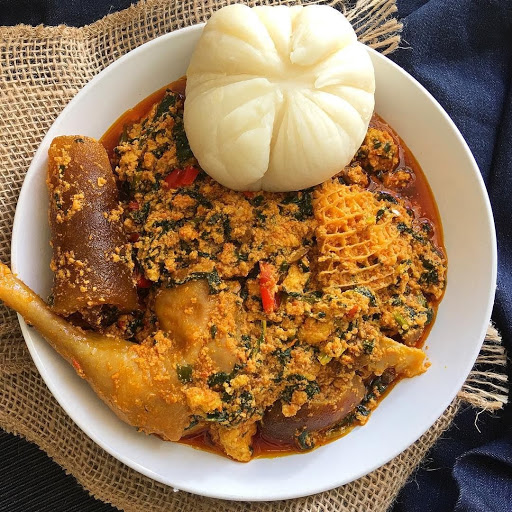 Thick egusi melon-seed soup served with pounded yam