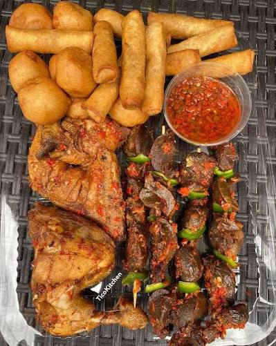 Nigerian small chops platter — samosas and puff-puff